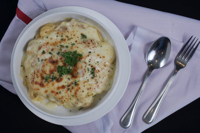 Baked pasta with meat sauce and melted cheese